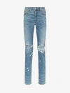 Amiri Paint Splatter Distressed Jeans Indigo In Blue