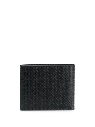 Ferragamo Logo Embossed Bi-fold Wallet In Black