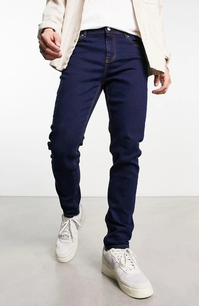 Asos Design Skinny Jean In Dark Blue Vintage Japanese Wash With Abrasions