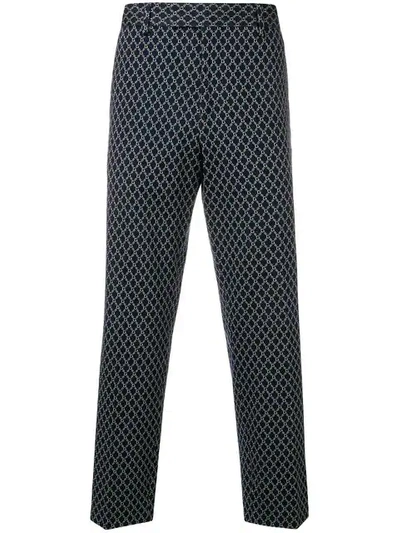 Gucci All-over Logo Print Trousers In Blue