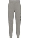 Versace Printed Logo Cotton Jersey Sweatpants In Grigio Chiaro