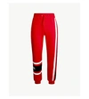 Givenchy Logo-embroidered Cotton-jersey Jogging Bottoms In Red/black