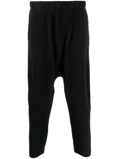 Issey Miyake Technical Pleated-jersey Tapered-leg Trousers In Black