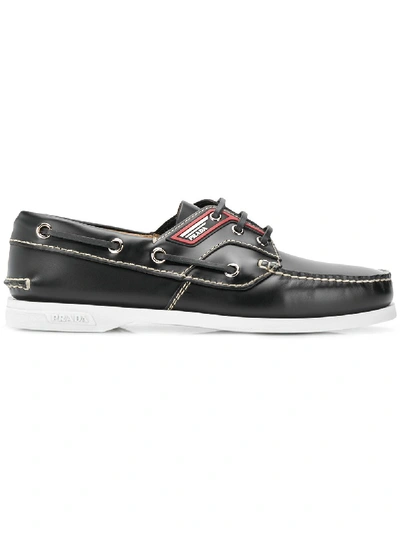 Prada Brushed Leather Boat Shoes In Black