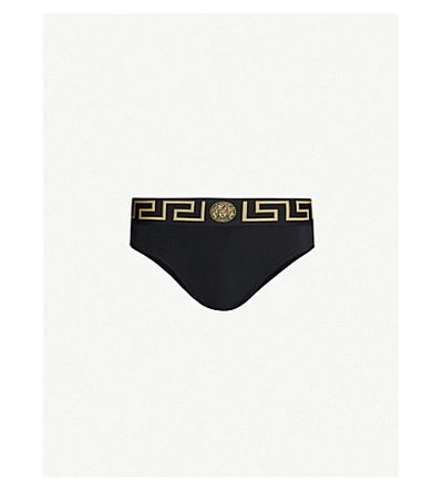 Versace Iconic Low-rise Swim Briefs In Black Gold