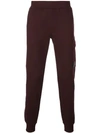 C.p. Company Round Logo Track Pants In Brown