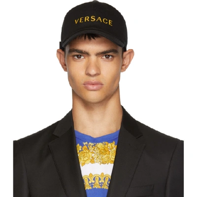 Versace Logo Embroidered Baseball Cap In Black