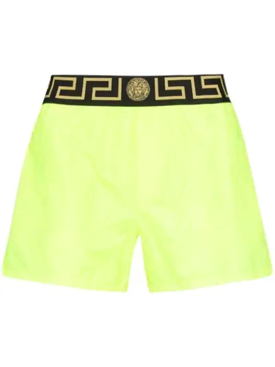 Versace Greca Border Swim Shorts In Yellow