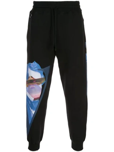 Undercover Valentino Tapered Printed Fleece-back Cotton-jersey Sweatpants In Black