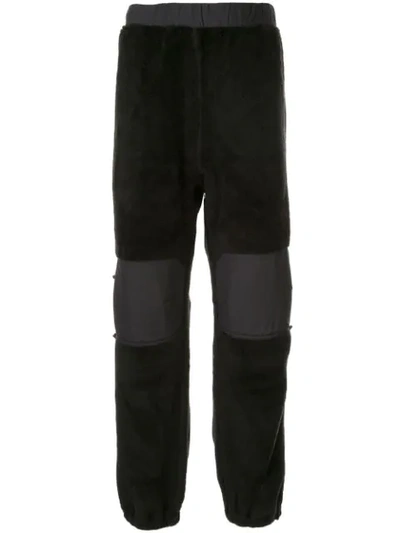 Undercover Shearling Detail Trousers In Black