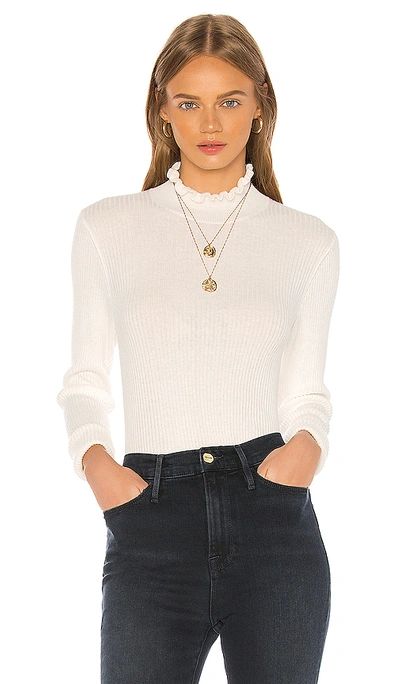 Frame Ruffle Turtleneck Sweater In Off White