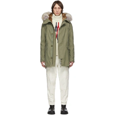 Yves Salomon Khaki Down & Fur Parka In Kaki Trim 1: 100% Coyote. Trim 2: 100% Rabbit. Padding: 90% Duck Down, 10% Feather.