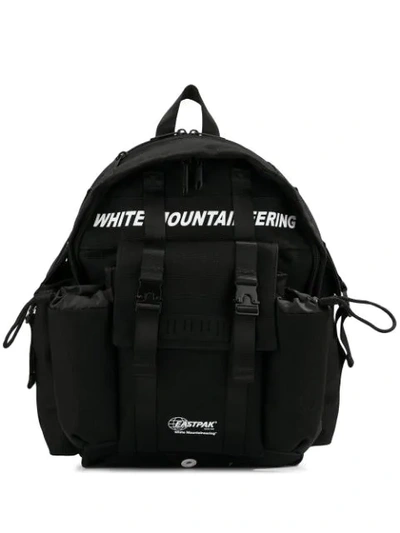 White Mountaineering Logo Print Backpack In Black
