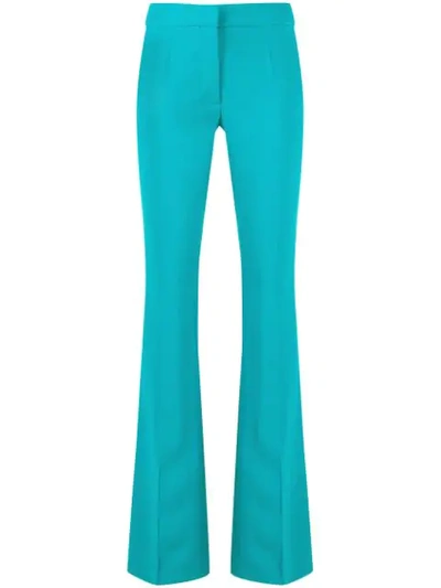 Moschino Flared Mid-rise Trousers In Green