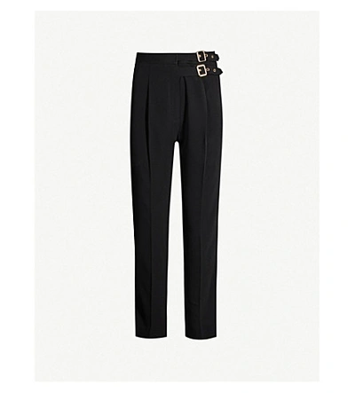 Sandro Buckle High-rise Tapered Crepe Trousers In Black