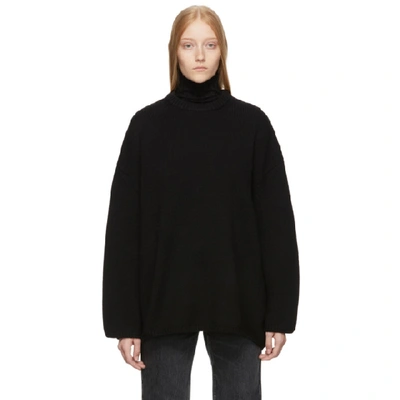Totême Noma Asymmetrical-hem Merino Wool Sweater In Black