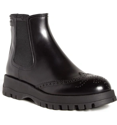 Prada Lug Sole Chelsea Boot In Black Leather