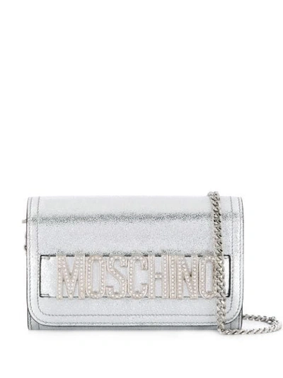 Moschino Embellished Logo Clutch Bag In Silver
