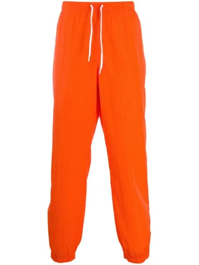 Msgm Technical Fabric Loose-fit Track Trousers In Orange