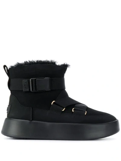Ugg Crossover Strap Buckled Boots In Black
