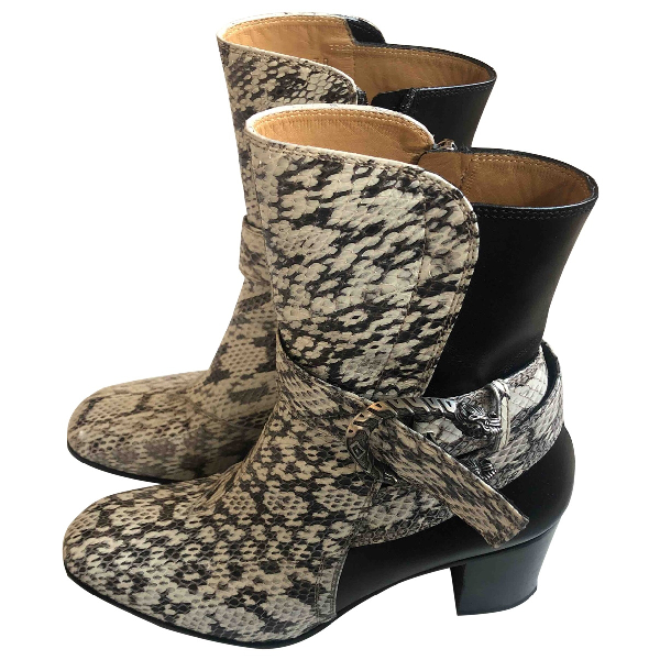 gucci combat boots with snake on bottom