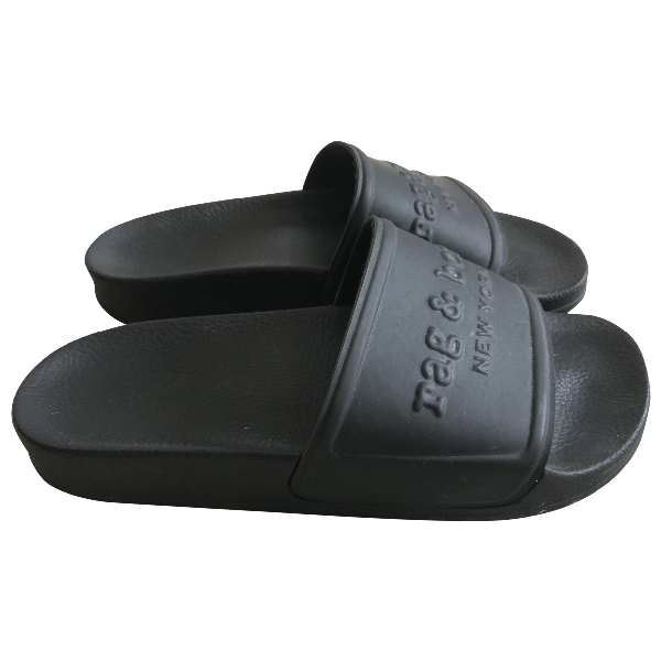 black rubber clogs