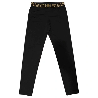 Pre-owned Versace Black Spandex Trousers