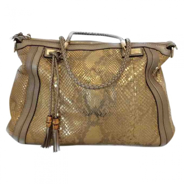 Pre-Owned Gucci Gold Python Handbag | ModeSens