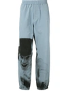 Undercover A Clockwork Orange Print Track Pants In Blue