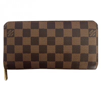 Pre-owned Louis Vuitton Zippy Brown Cloth Wallet