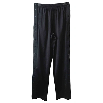 Pre-owned Asics Large Trousers In Black