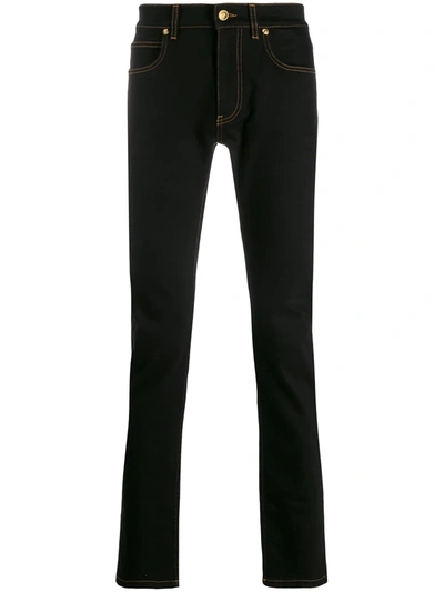 Versace Embroidered Safety Pin Jeans In Black