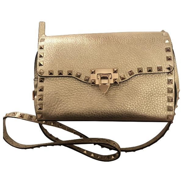 PreOwned Valentino Garavani Rockstud Gold Leather Clutch Bag ModeSens