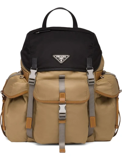 Prada Logo Plaque Backpack In Brown