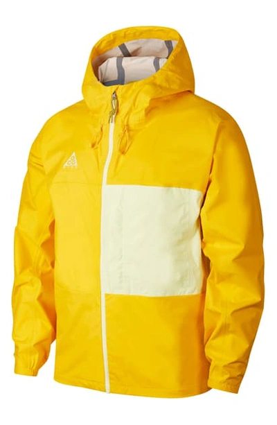 Nike Acg Packable Rain Jacket In University Gold/ Green