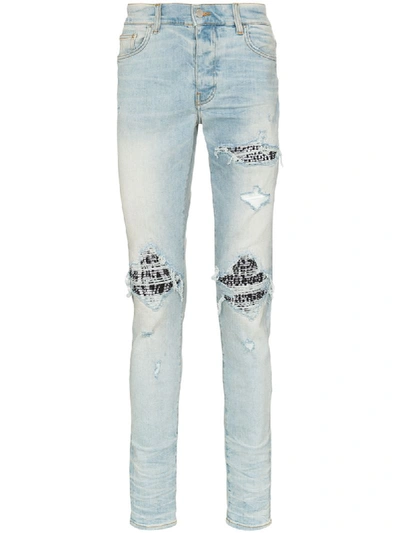 Amiri Mx1 Shredded Animal Detail Jeans In Blue