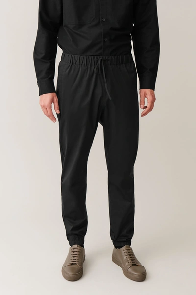 Cos Relaxed-fit Cuffed Trousers In Black