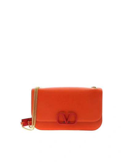 Valentino Garavani Vlock Shoulder Bag In Orange