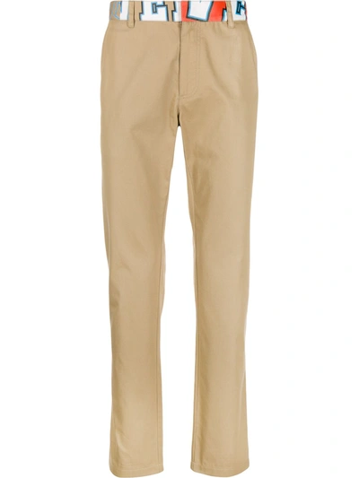 Versace Abstract Logo Print Slim Trousers In Neutrals