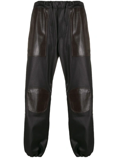 Gr-uniforma Panelled Faux-leather Trousers In Black