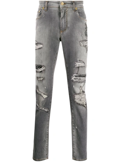 Dolce & Gabbana Heraldic Patch Ripped Jeans In Grey