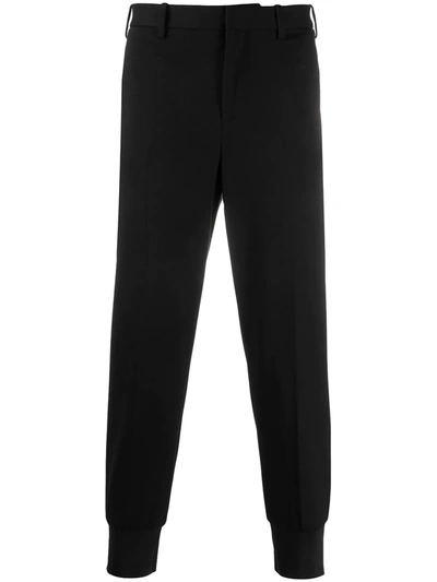 Neil Barrett Fitted Cuffs Tapered Trousers In Black