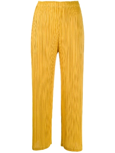 Issey Miyake Pleated Wide-leg Trousers In Yellow