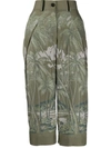 Sacai Cropped Length Palm Print Trousers In Green