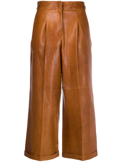 Arma Cropped Flared Leg Trousers In Brown