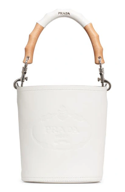 Prada Logo Embossed Leather Bucket Bag In Bianco/ Nero