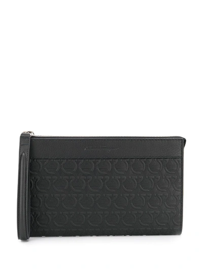 Ferragamo Logo Embossed Leather Travel Pouch In Black