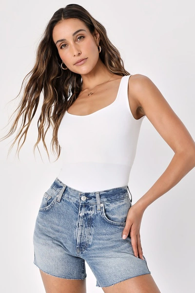 Free People Loving Good Vibrations Cotton Frayed Denim Shorts In Light Denim