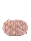 Miu Miu Mini Matelassé Leather Oval Crossbody Bag In Pink