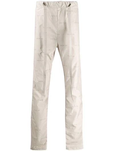 Fear Of God Logo Print Track Trousers In Neutrals